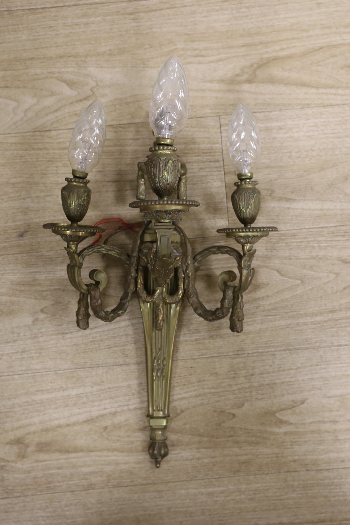 A Louis XVI style ormolu three branch wall light 55cm